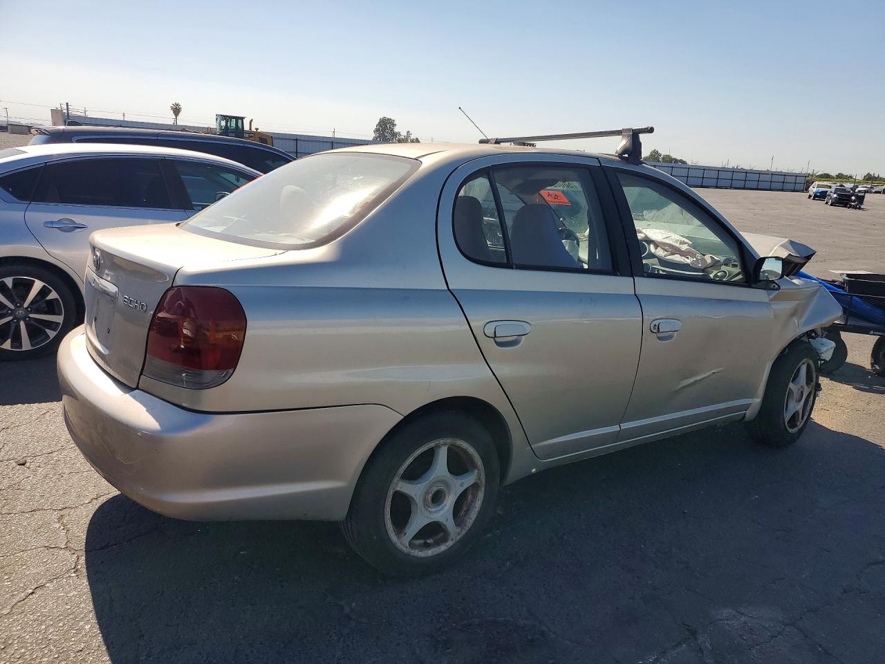 2003 Toyota Echo Base Tan vin: JTDBT123630259965