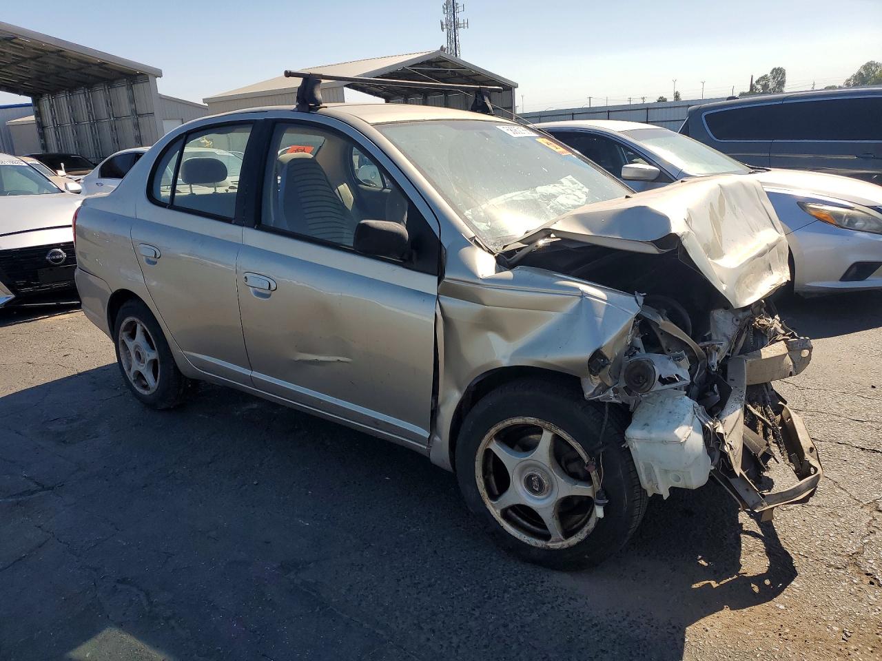 2003 Toyota Echo Base Tan vin: JTDBT123630259965