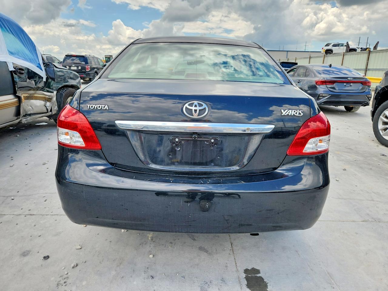 2010 Toyota Yaris Base Black vin: JTDBT4K35A4063572