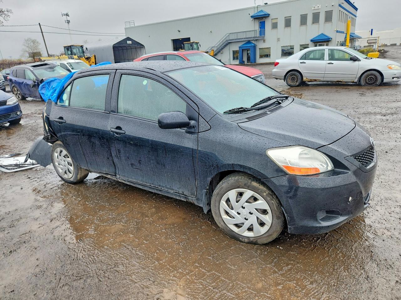2011 Toyota Yaris Base Black vin: JTDBT4K35B1412846