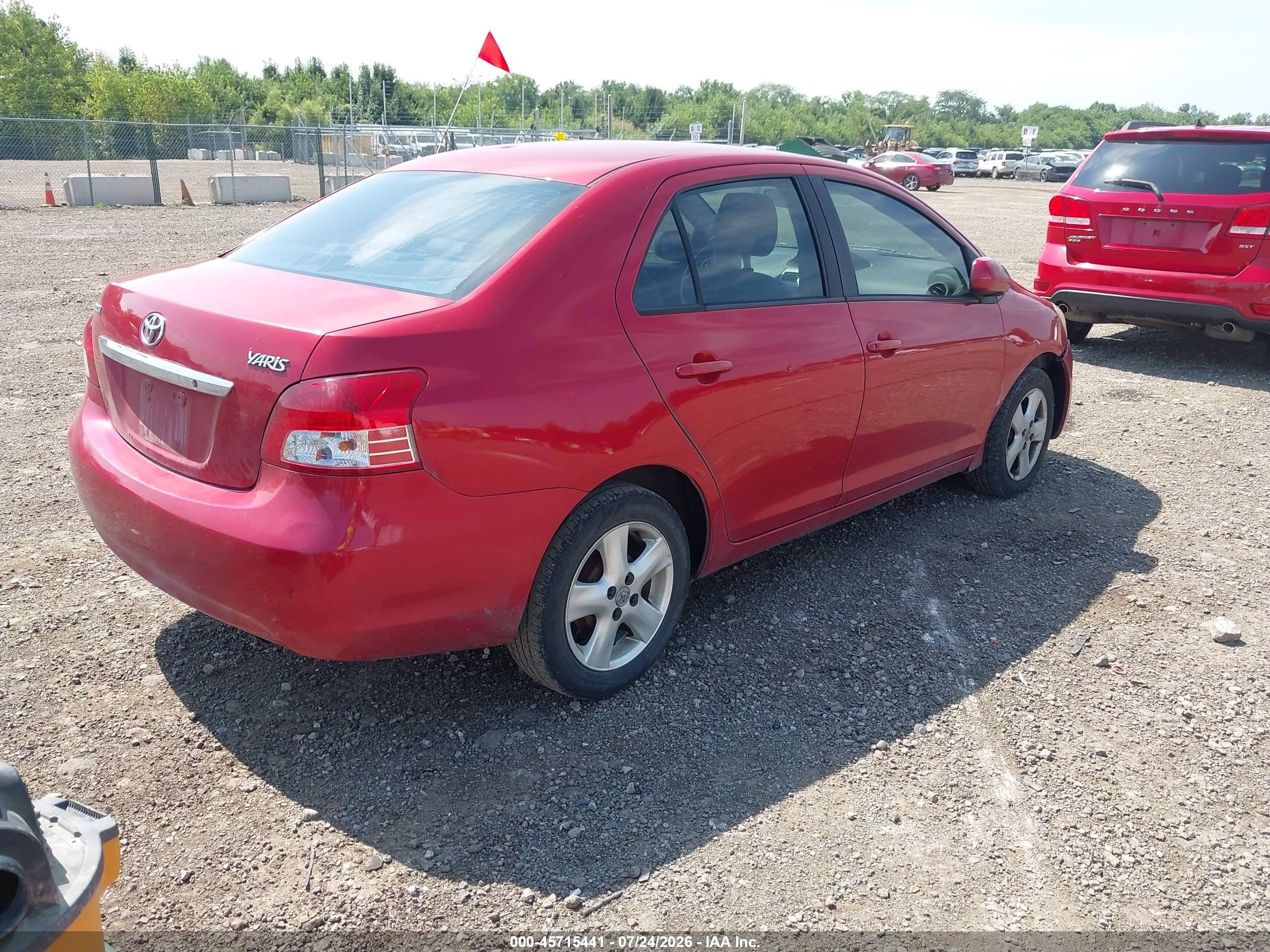 2010 Toyota Yaris   Red vin: JTDBT4K39A1369000