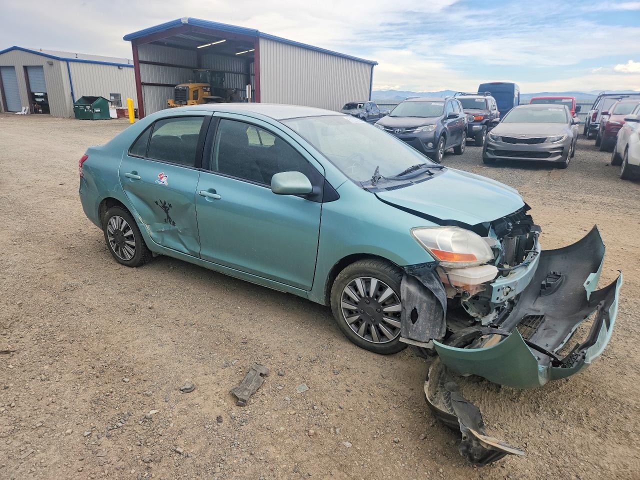 2009 Toyota Yaris Base Green vin: JTDBT903494046483
