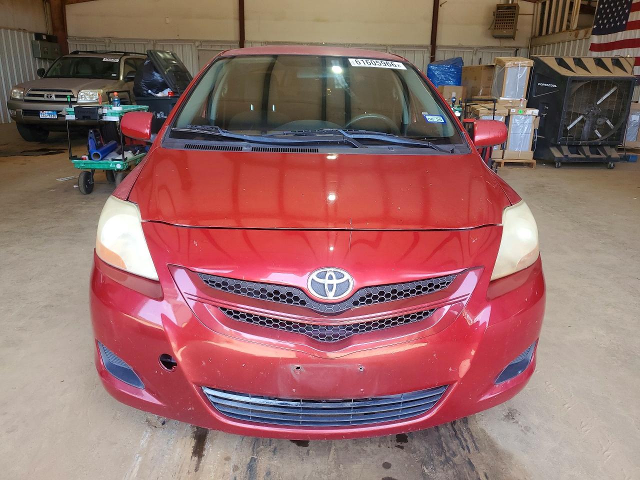 2009 Toyota Yaris Base Red vin: JTDBT903694053662