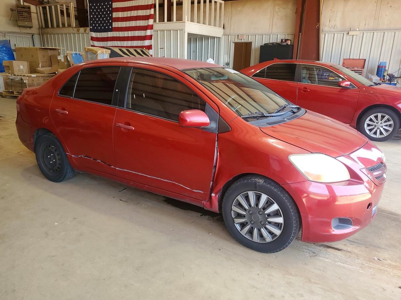 2009 Toyota Yaris Base Red vin: JTDBT903694053662