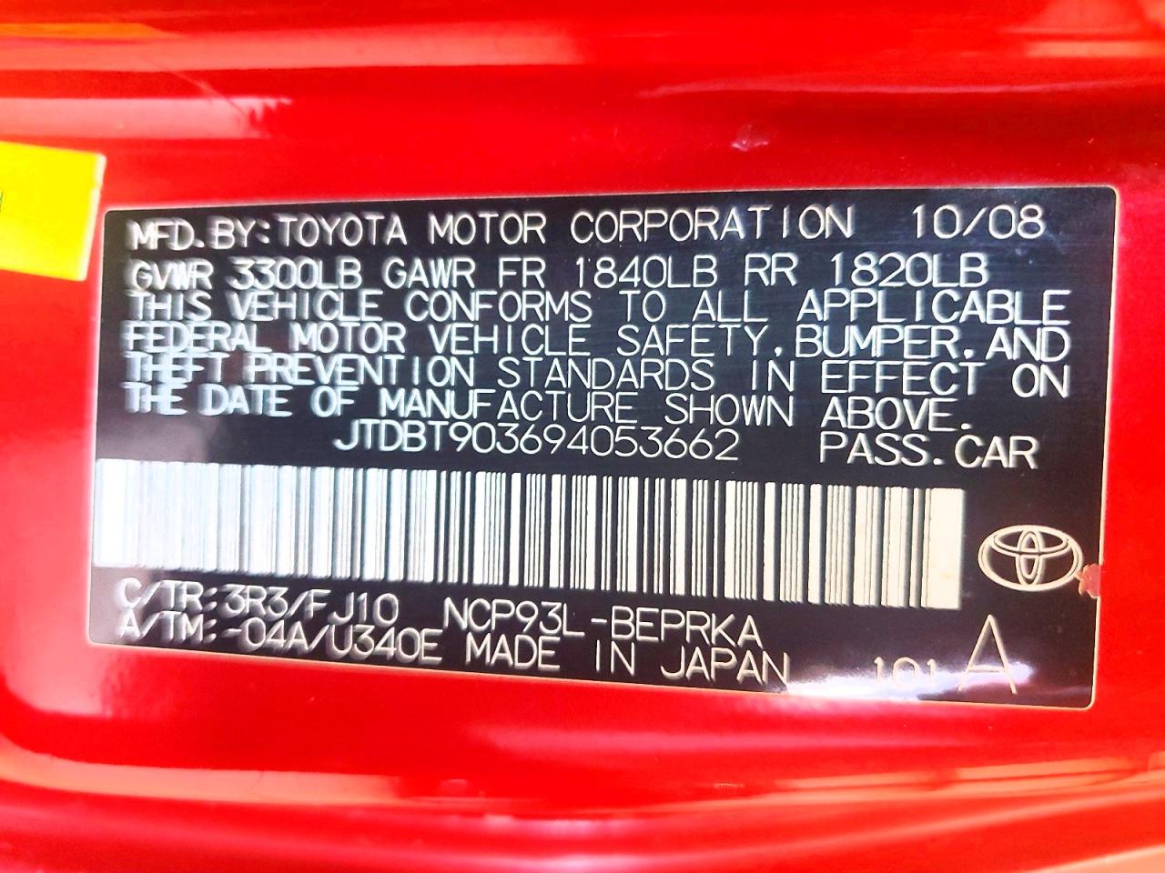 2009 Toyota Yaris Base Red vin: JTDBT903694053662