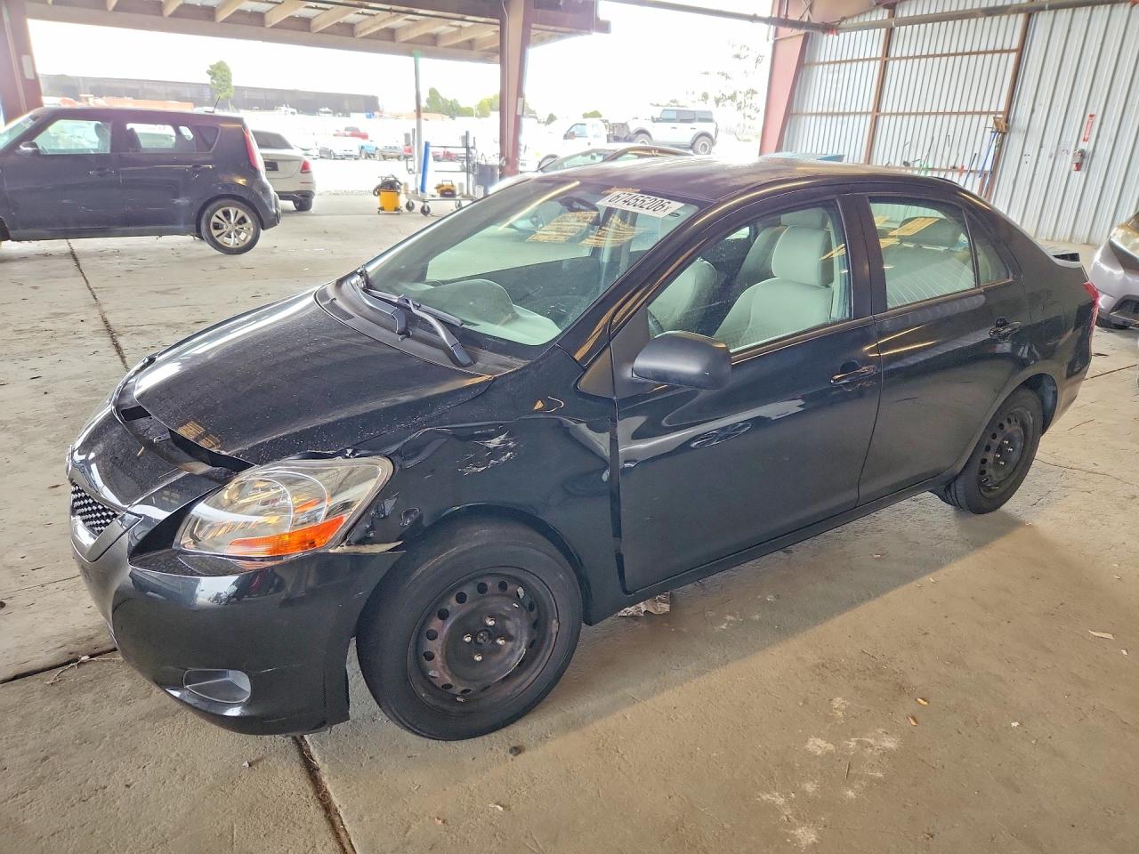 2009 Toyota Yaris Base Black vin: JTDBT903791299055
