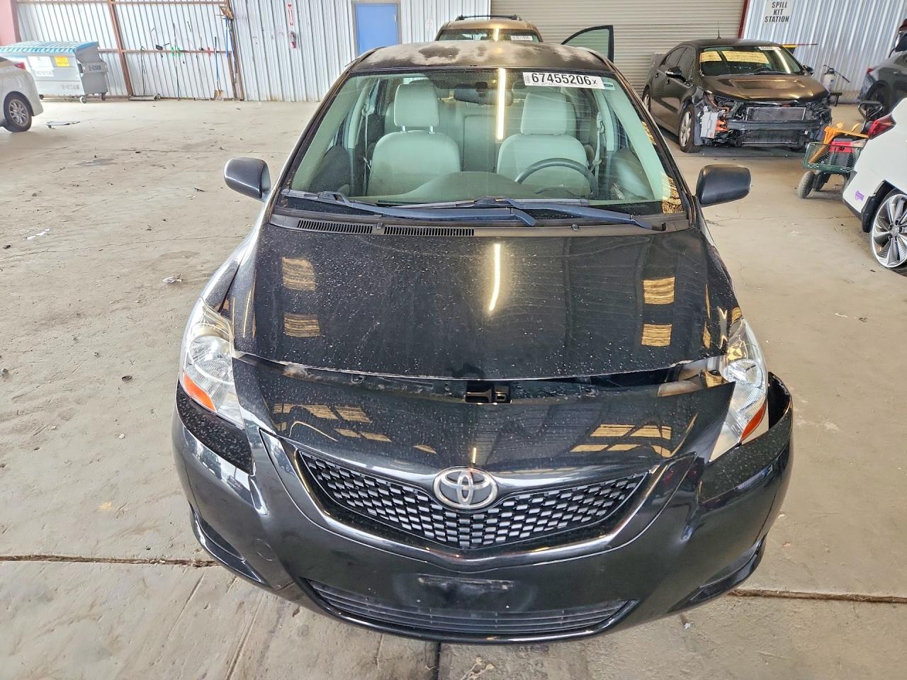 2009 Toyota Yaris Base Black vin: JTDBT903791299055
