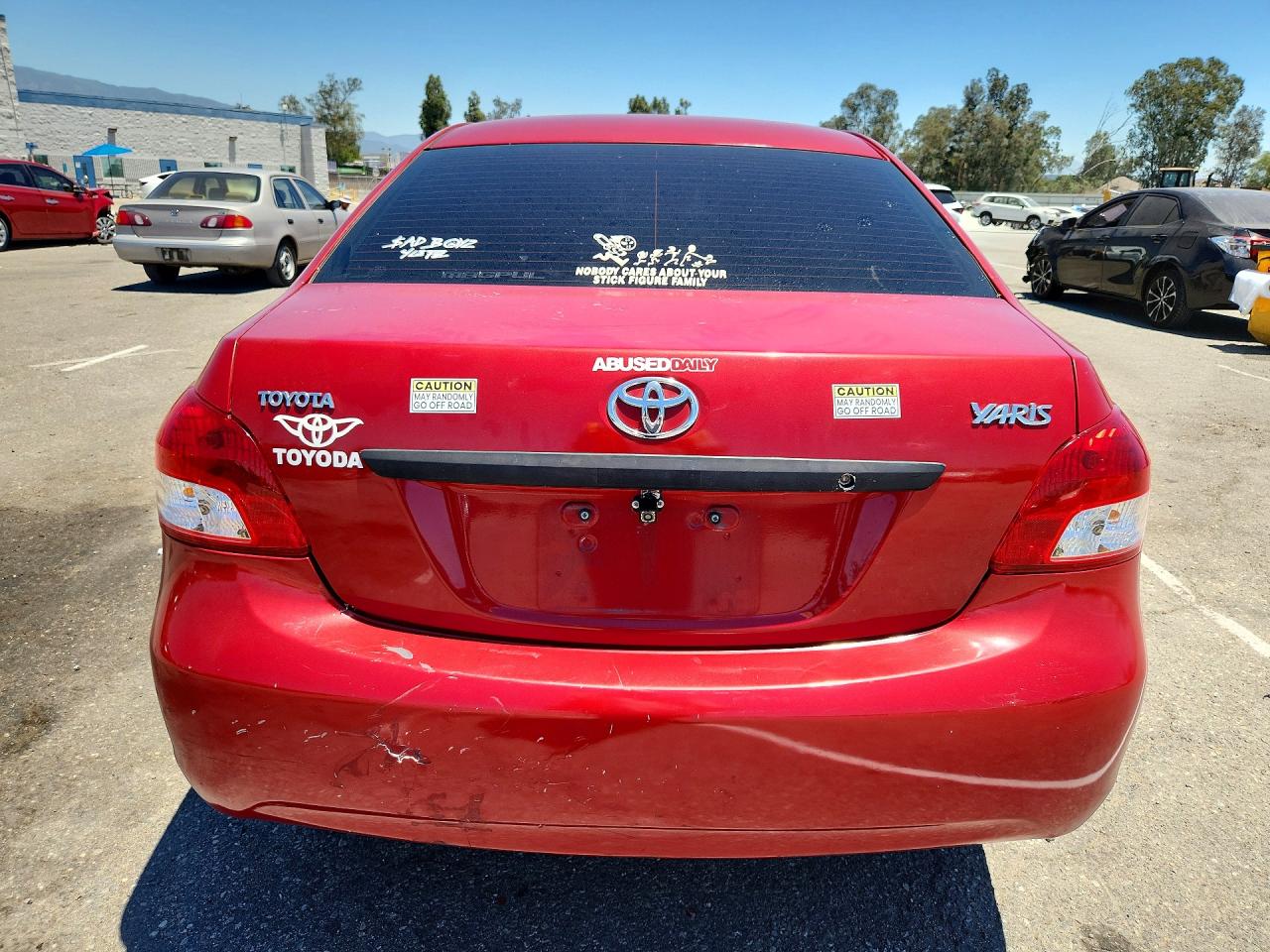 2009 Toyota Yaris Base Red vin: JTDBT903791339571