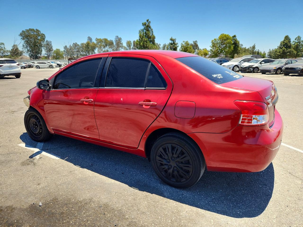 2009 Toyota Yaris Base Red vin: JTDBT903791339571