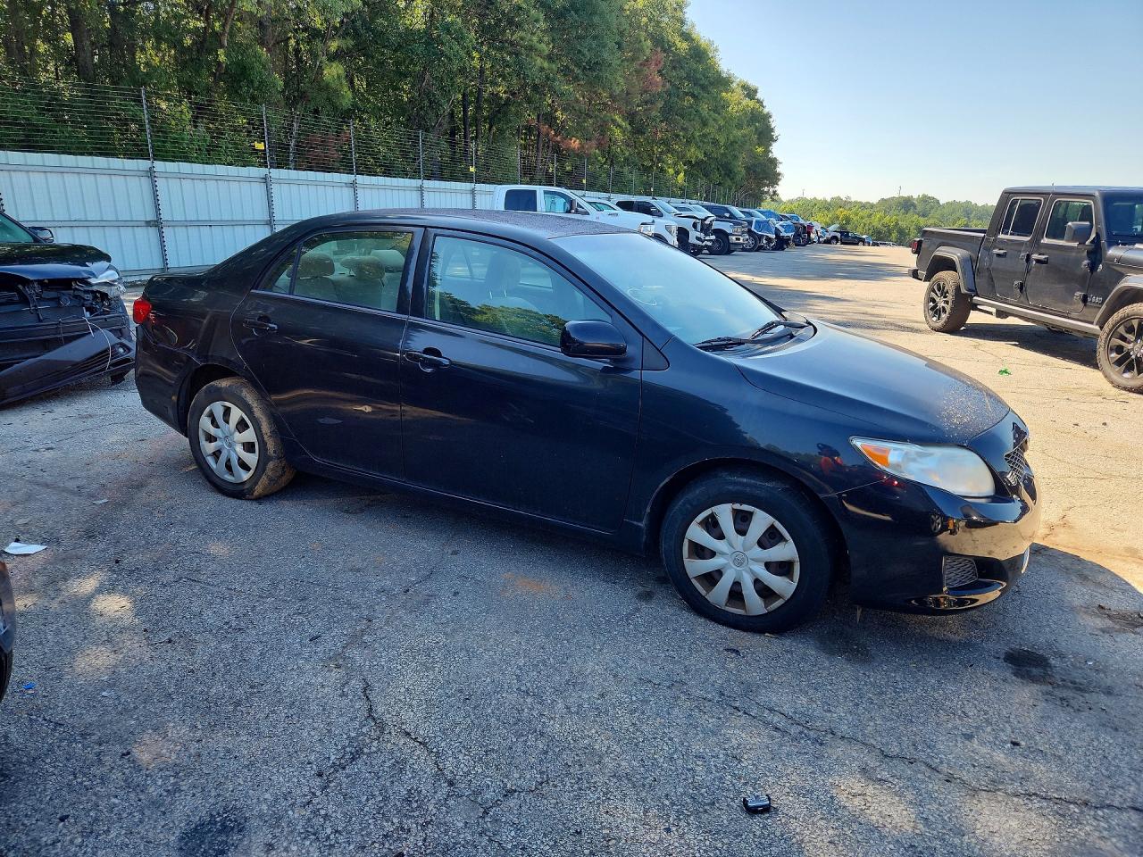 2010 Toyota Corolla Le Black vin: JTDBU4EE1AJ077836