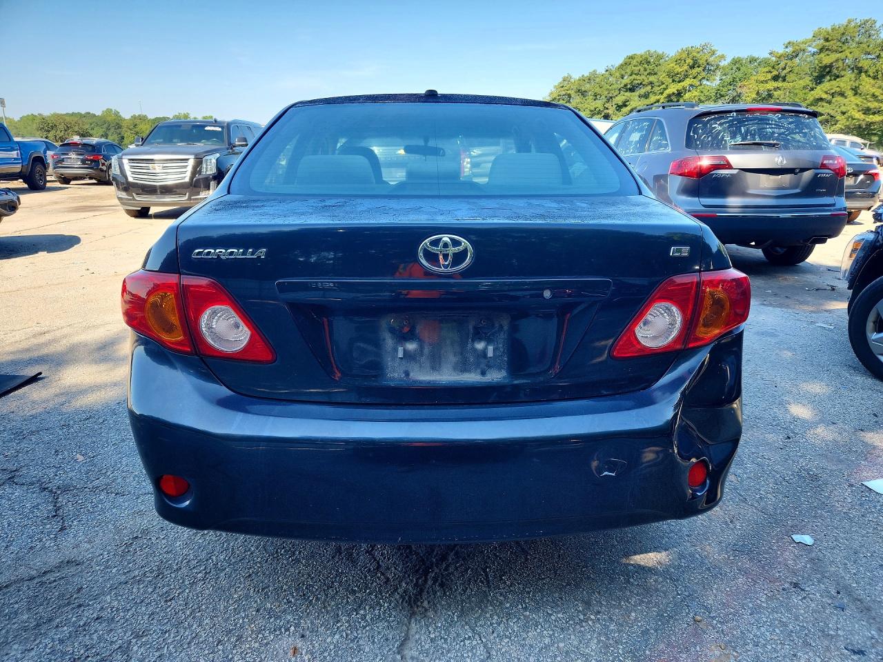 2010 Toyota Corolla Le Black vin: JTDBU4EE1AJ077836