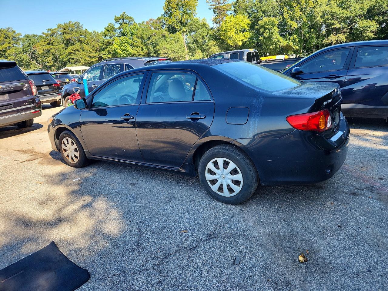 2010 Toyota Corolla Le Black vin: JTDBU4EE1AJ077836