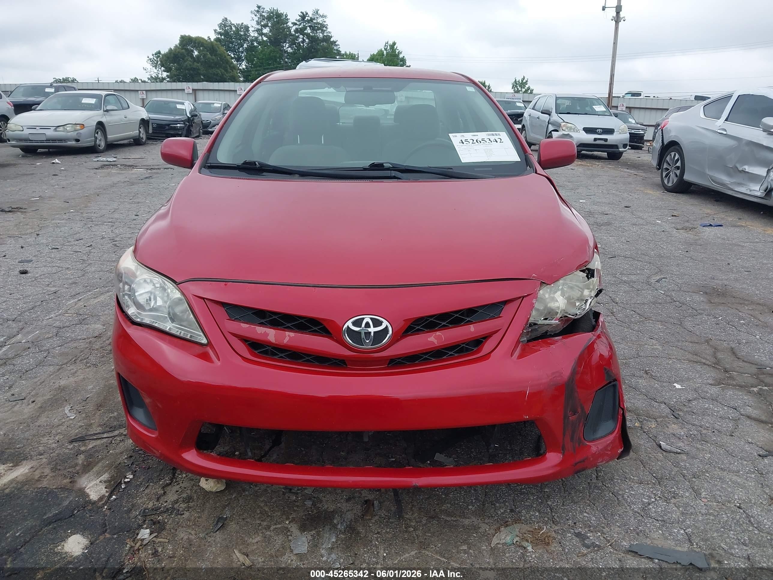 2011 Toyota Corolla Le Red vin: JTDBU4EE1BJ097599