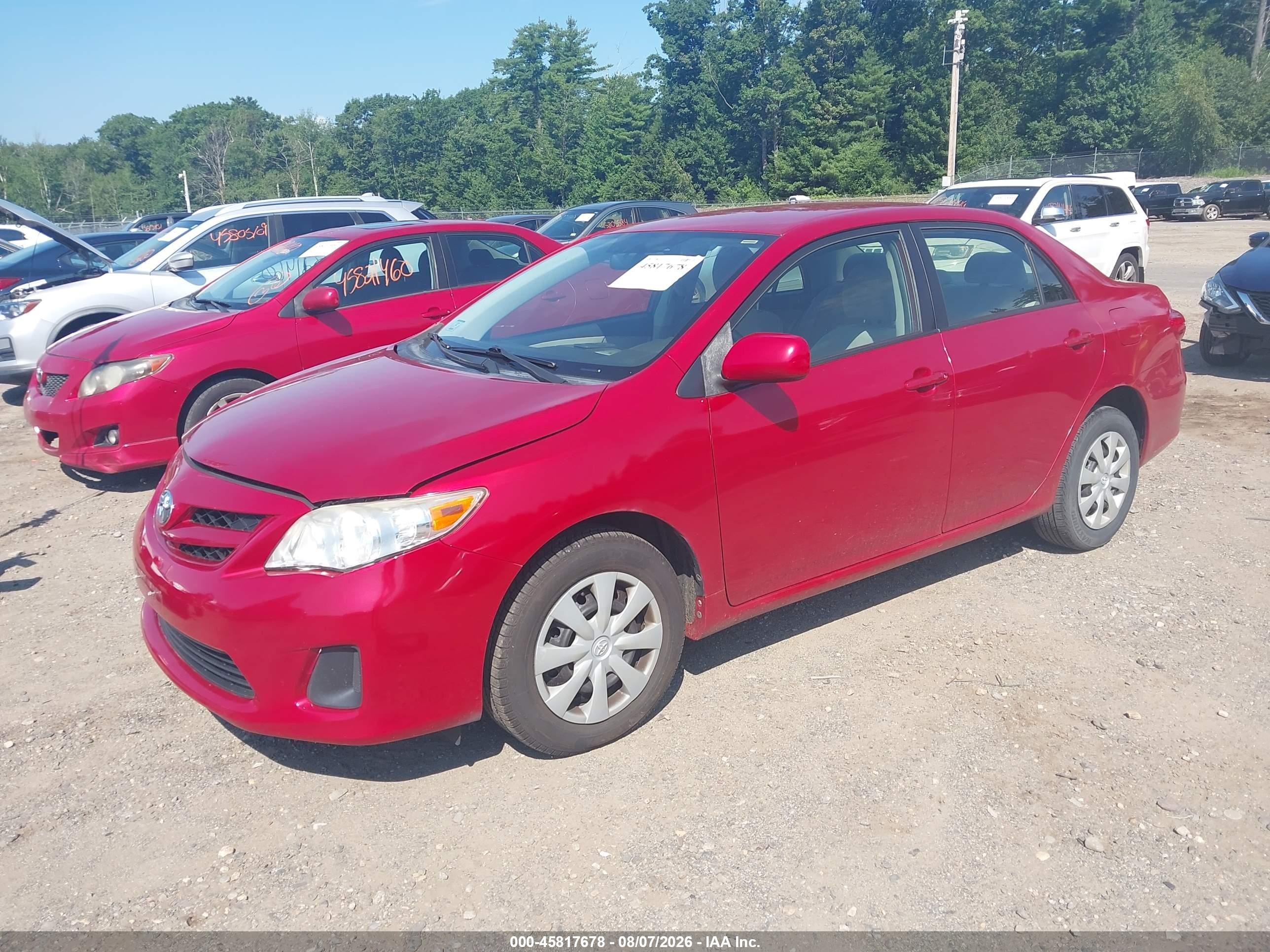 2011 Toyota Corolla Le Red vin: JTDBU4EE3B9138610