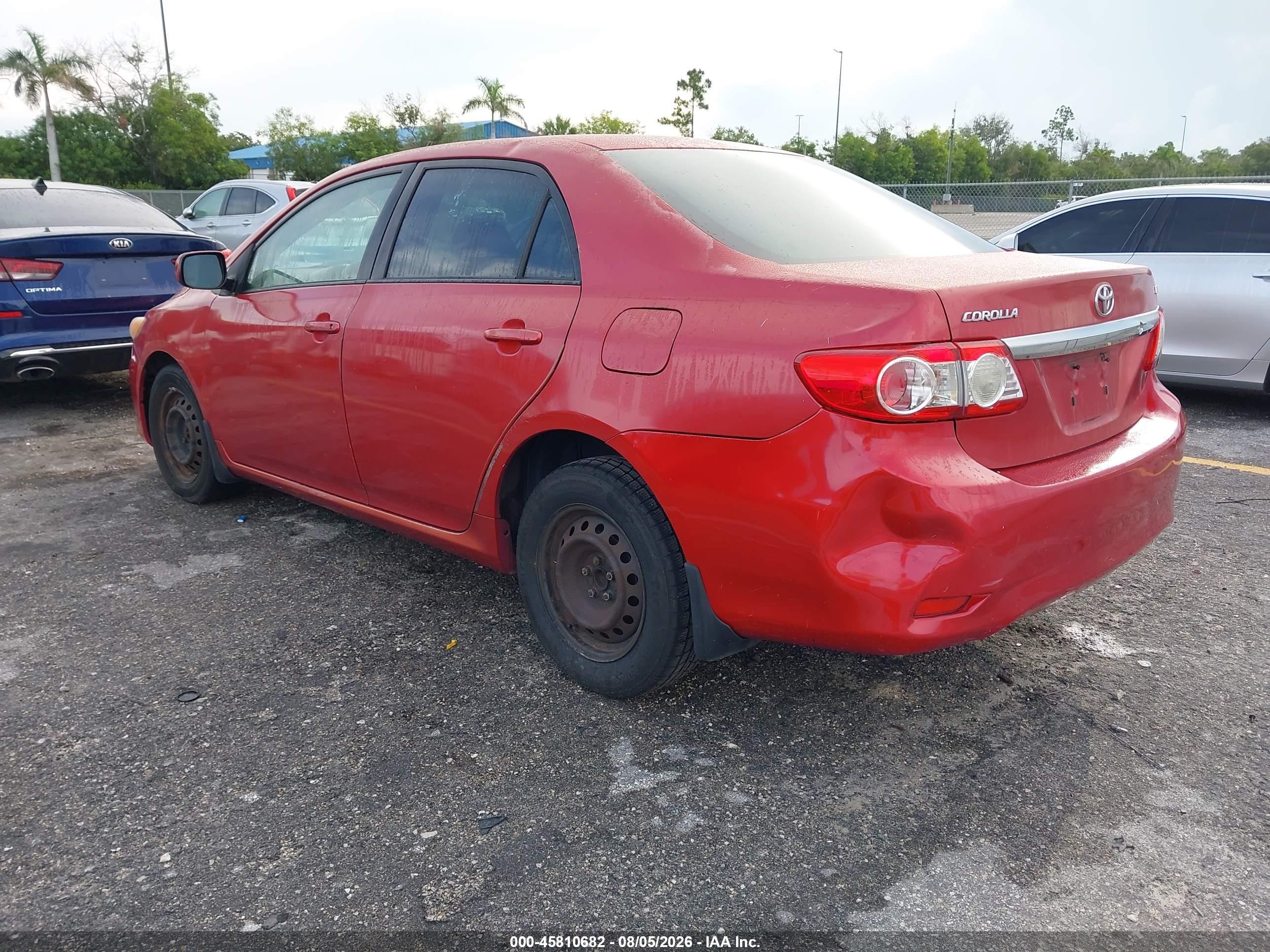 2011 Toyota Corolla Le Red vin: JTDBU4EE3BJ093232