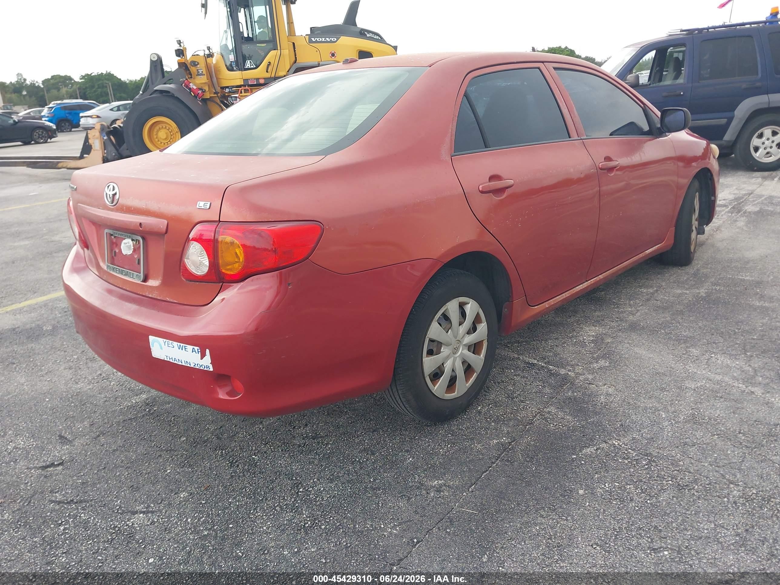 2010 Toyota Corolla Le Red vin: JTDBU4EE6A9111626