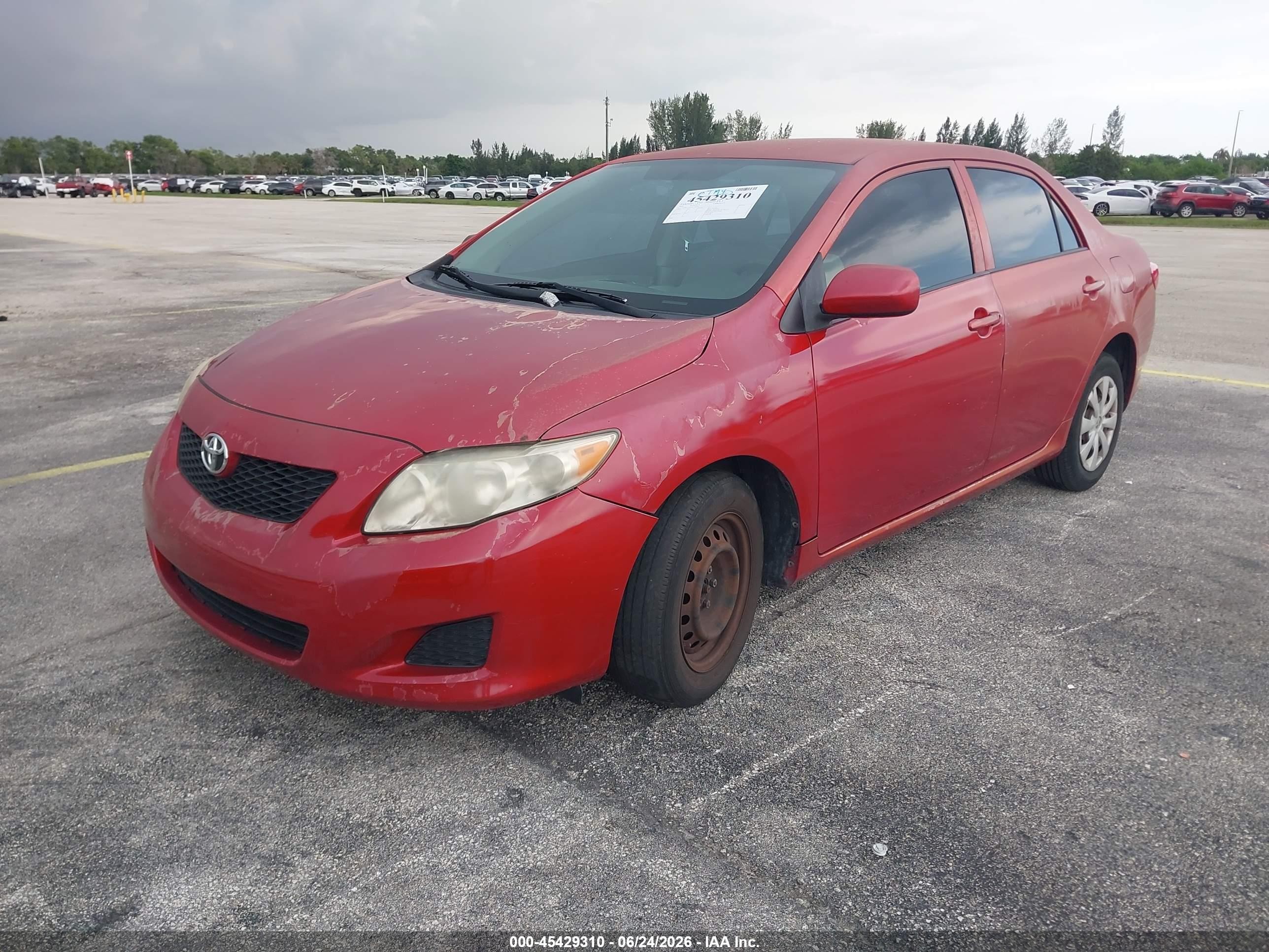 2010 Toyota Corolla Le Red vin: JTDBU4EE6A9111626