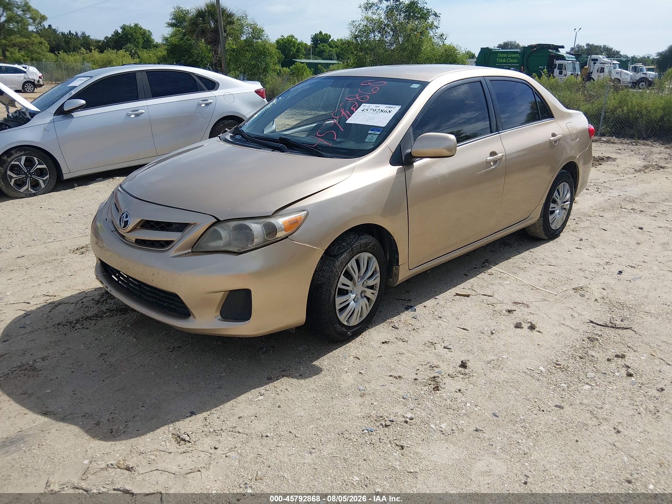 2011 Toyota Corolla Le Champagne vin: JTDBU4EE7B9155541