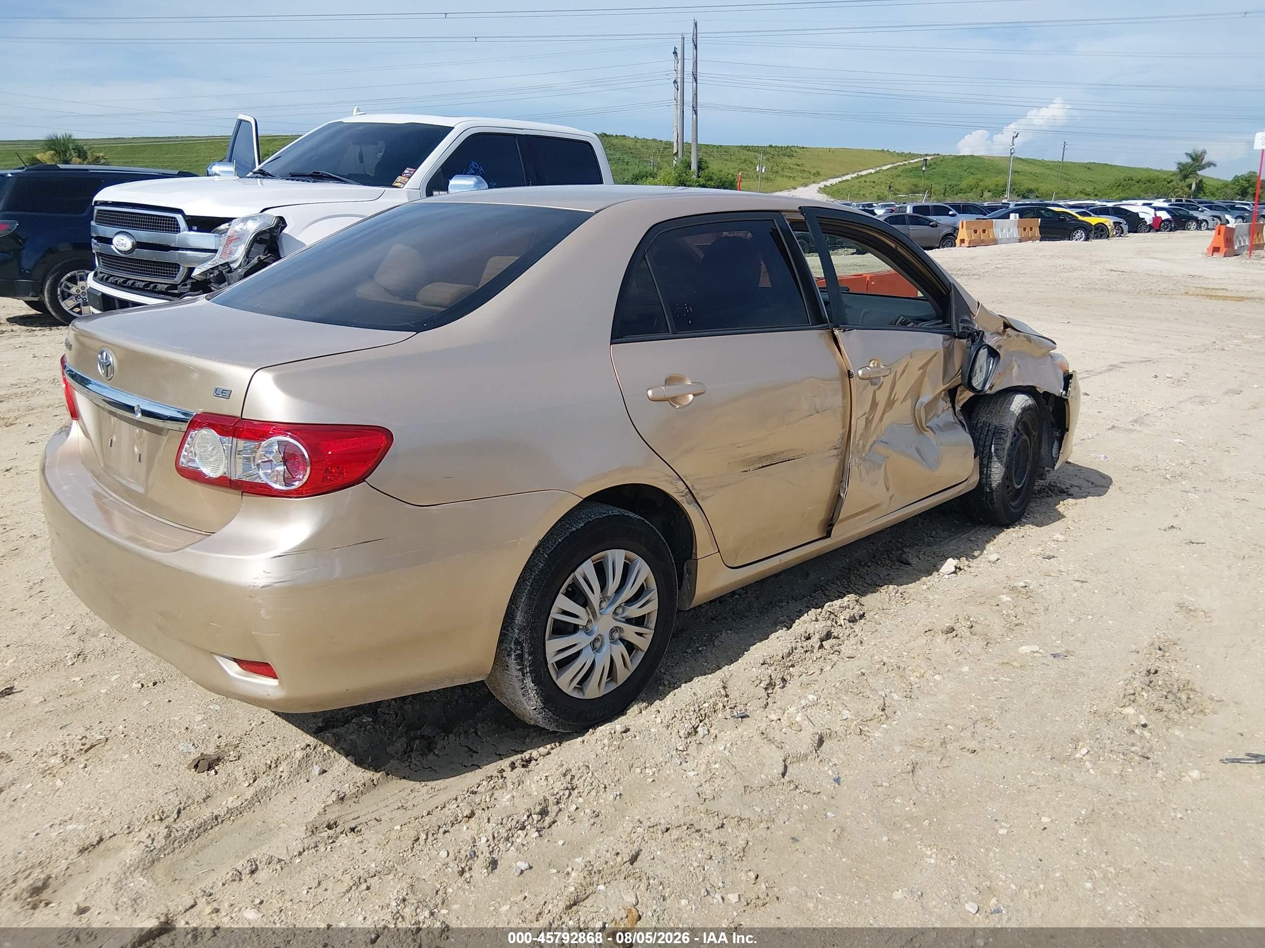 2011 Toyota Corolla Le Champagne vin: JTDBU4EE7B9155541