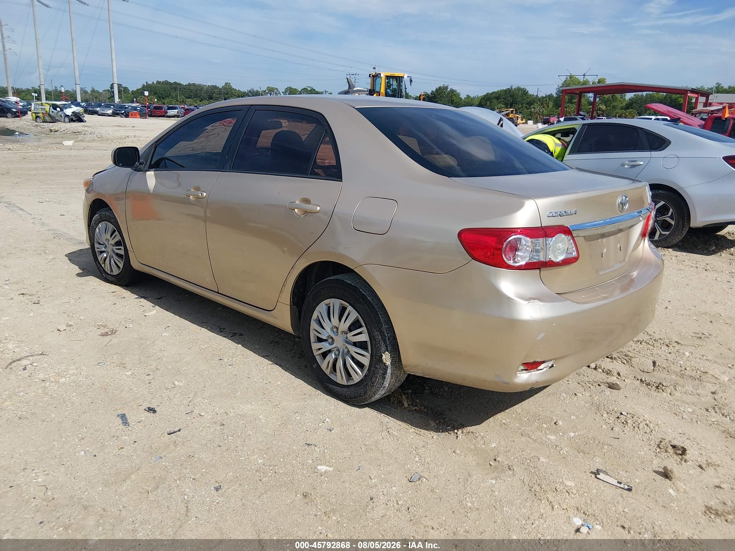 2011 Toyota Corolla Le Champagne vin: JTDBU4EE7B9155541