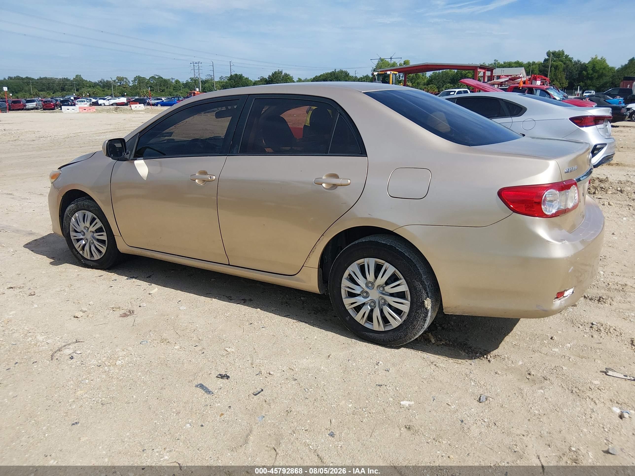 2011 Toyota Corolla Le Champagne vin: JTDBU4EE7B9155541