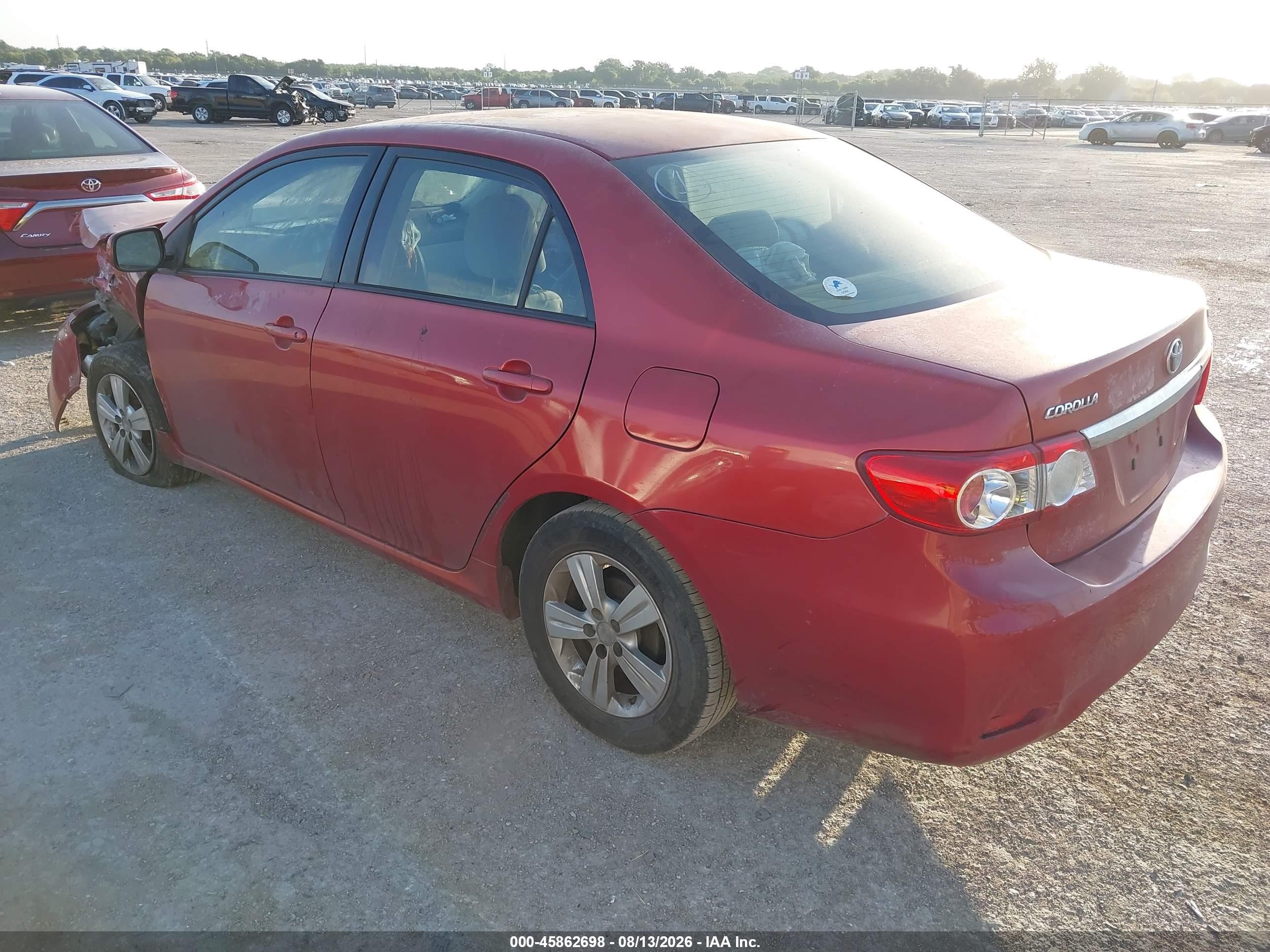 2011 Toyota Corolla Le Red vin: JTDBU4EE8B9133029