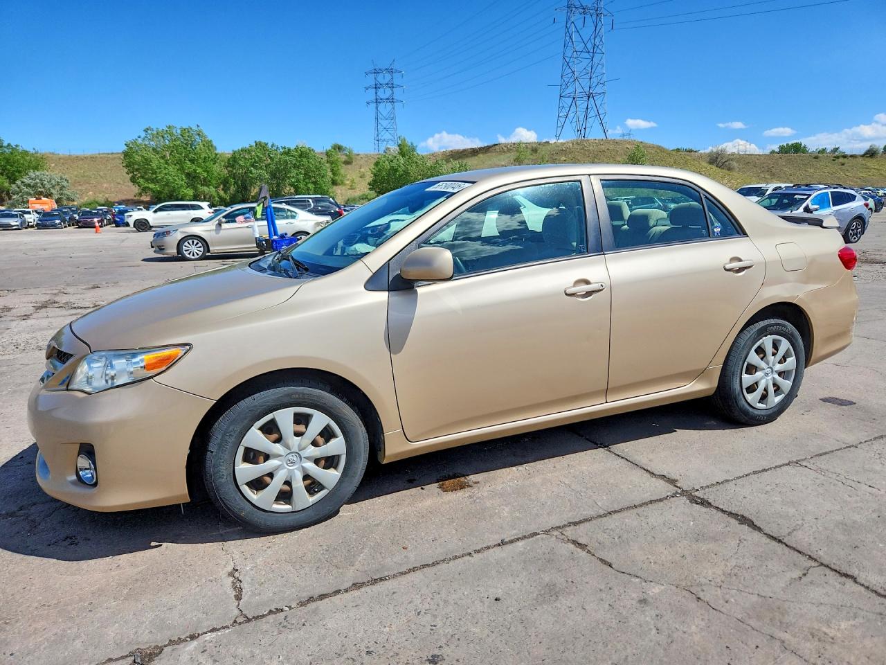 2011 Toyota Corolla Le Золотой vin: JTDBU4EE8B9135427