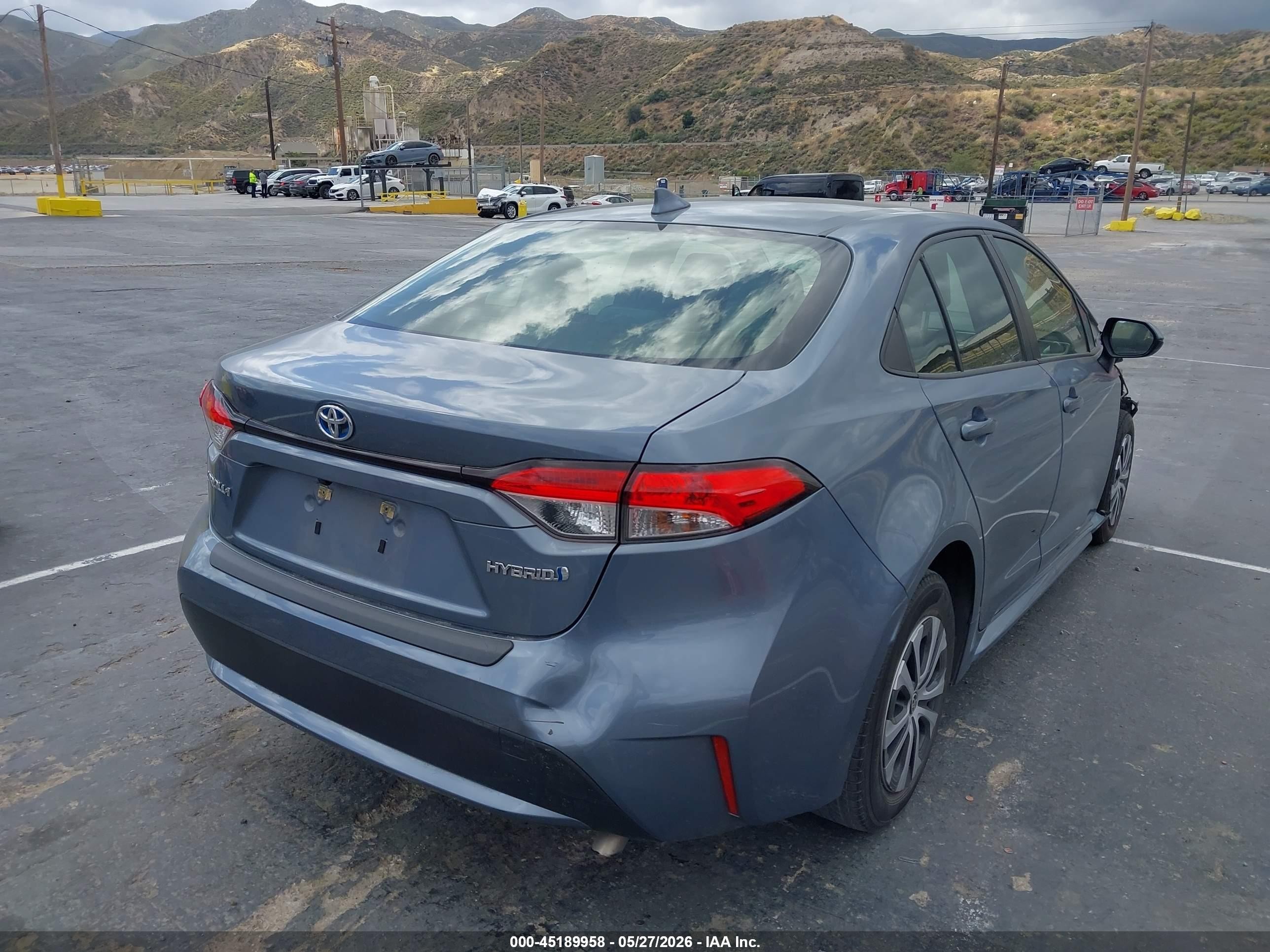 2021 Toyota Corolla Hybrid Le Blue vin: JTDEAMDE7MJ033139