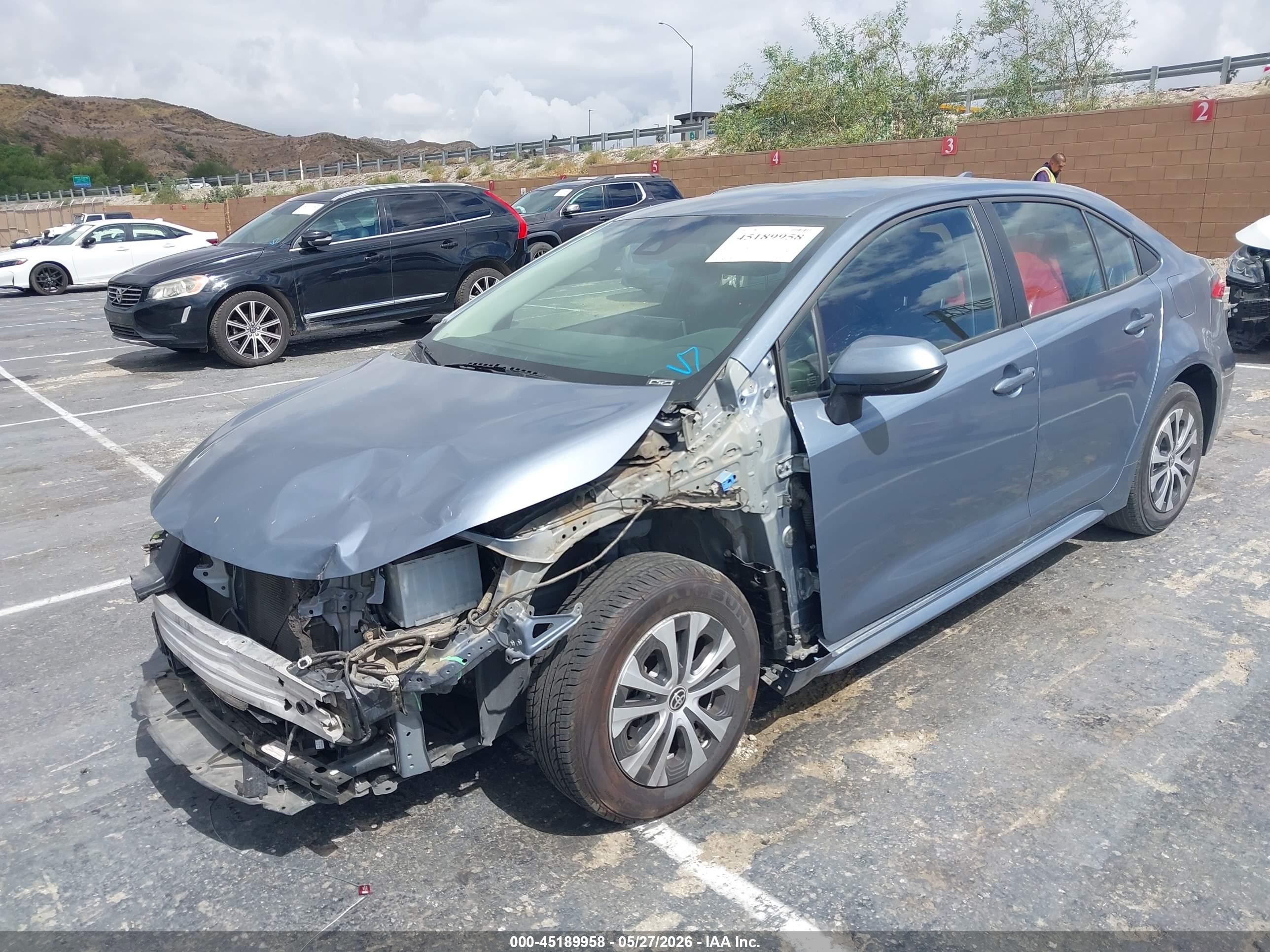 2021 Toyota Corolla Hybrid Le Blue vin: JTDEAMDE7MJ033139