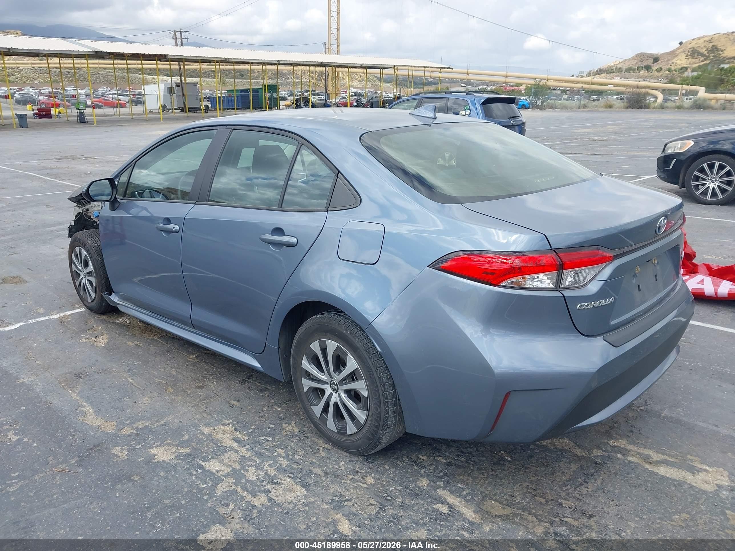 2021 Toyota Corolla Hybrid Le Blue vin: JTDEAMDE7MJ033139