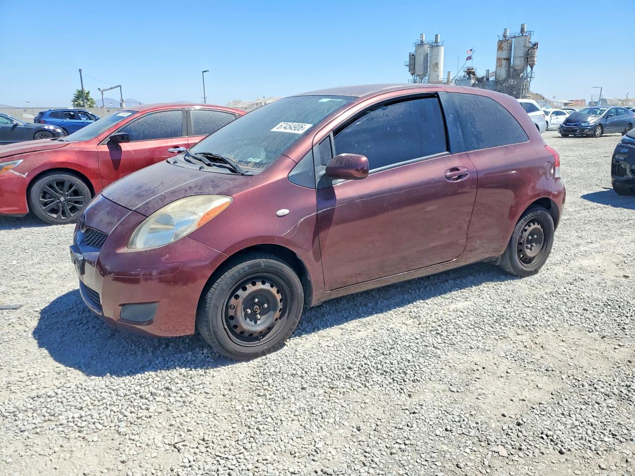 2009 Toyota Yaris Base Burgundy vin: JTDJT903095276477
