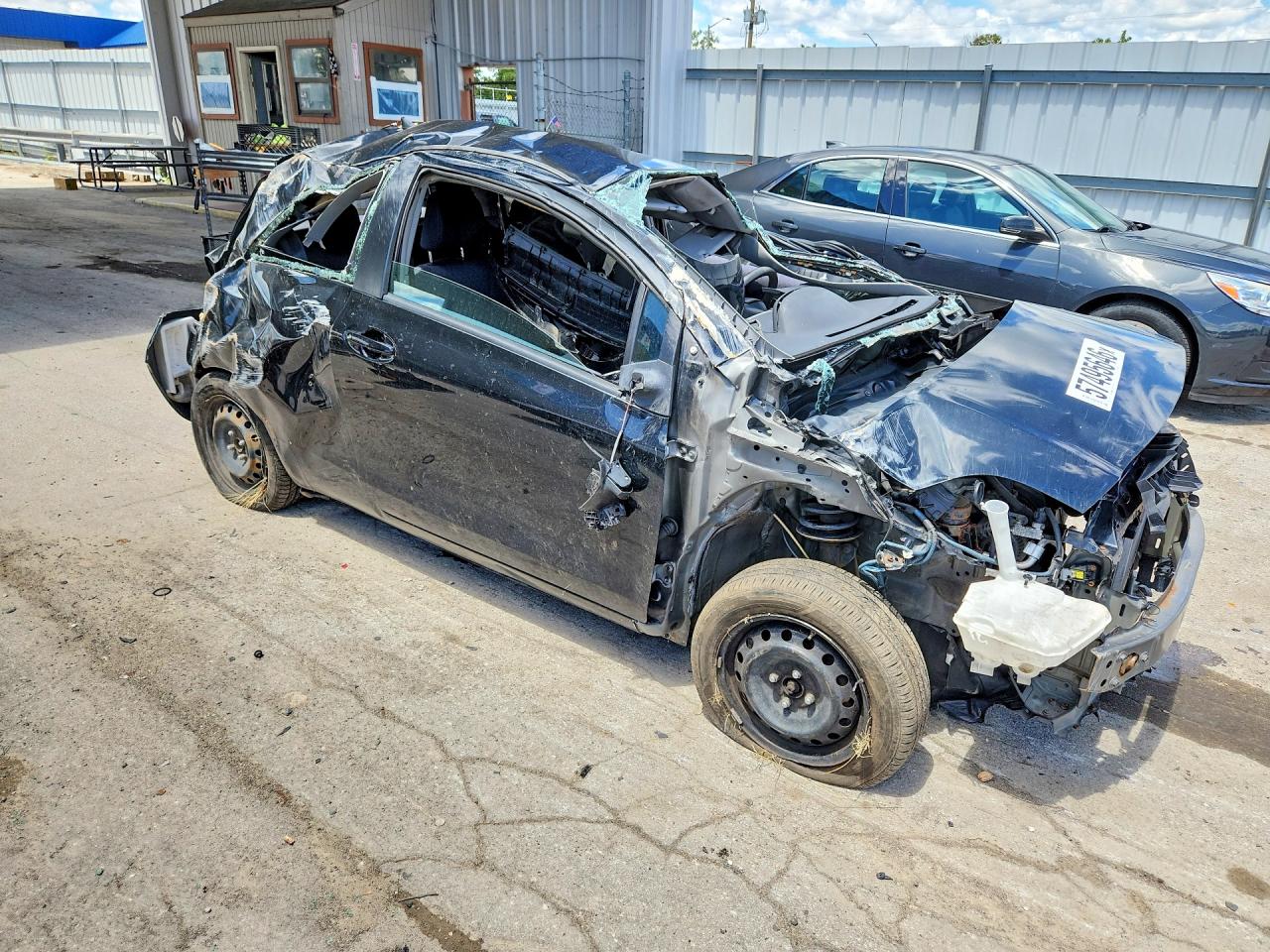 2009 Toyota Yaris Base Черный vin: JTDJT903295233856