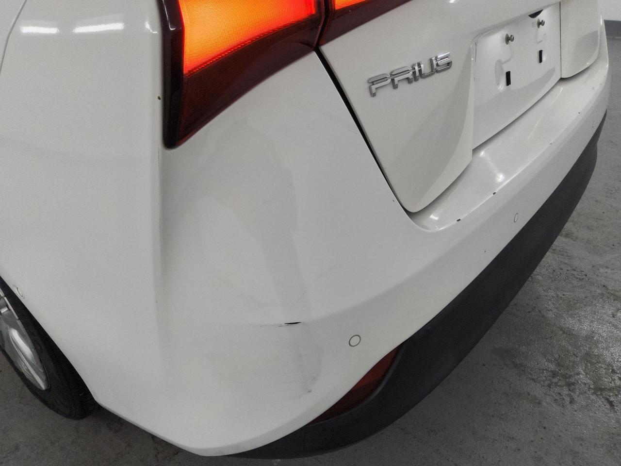 2021 Toyota Prius Le White vin: JTDKAMFU5M3148396 Damage: Rear Bumper, Heavy Scratch, 7 To 8 Inches
