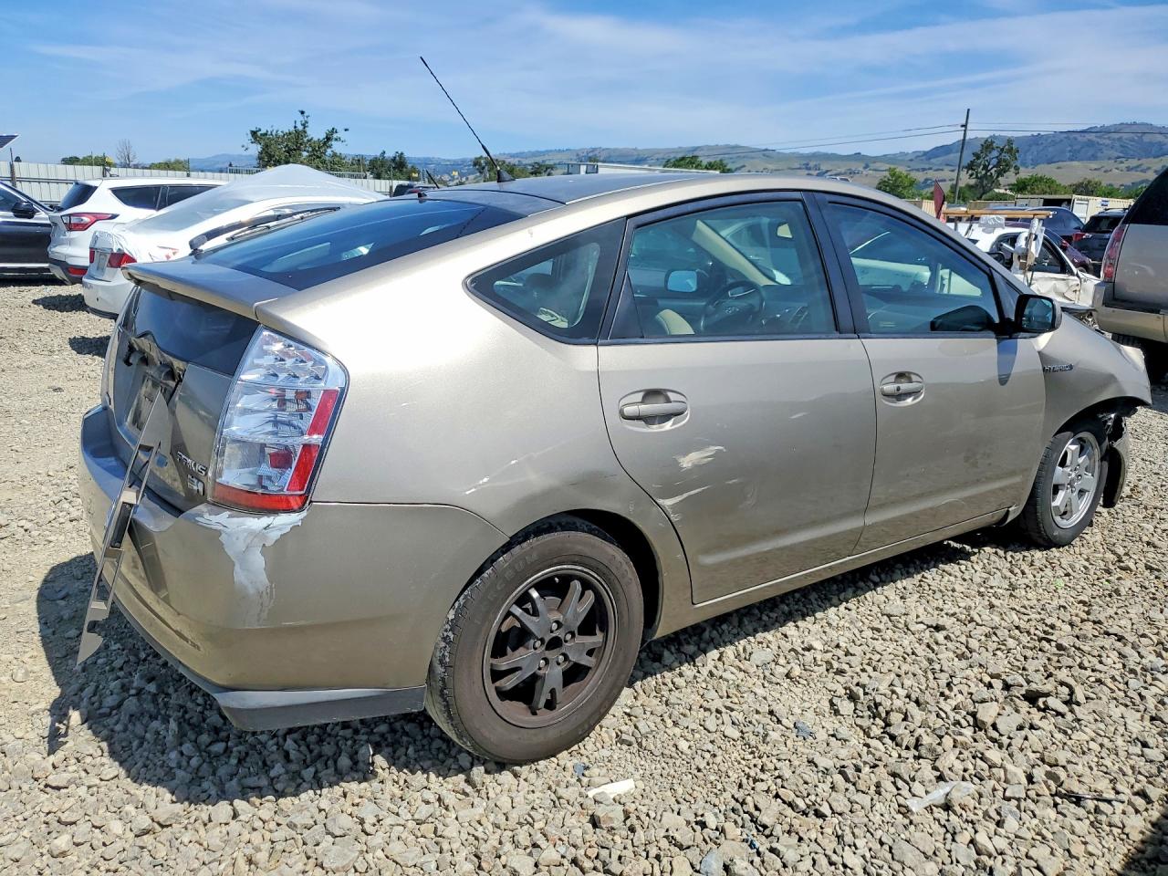 2007 Toyota Prius Base Желто-коричневый vin: JTDKB20U777576588
