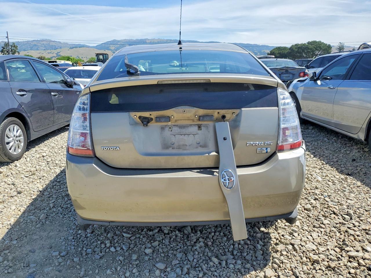 2007 Toyota Prius Base Желто-коричневый vin: JTDKB20U777576588