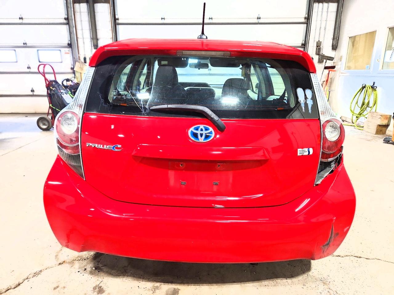 2012 Toyota Prius C Three Red vin: JTDKDTB34C1515524