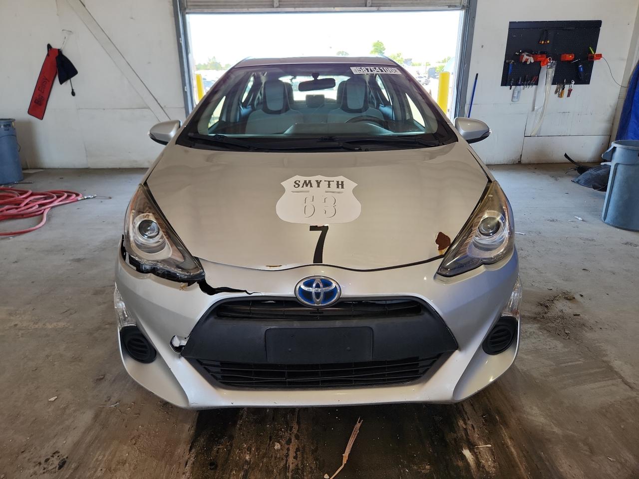 2015 Toyota Prius C One Silver vin: JTDKDTB34F1105357 Damage: Left Head Lamp, Broken, Replacement Required