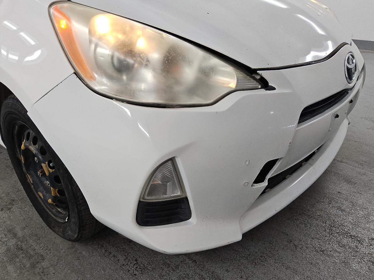 2012 Toyota Prius C Three White vin: JTDKDTB38C1026463 Damage: Front Bumper, Previous Repair, Substandard Repair