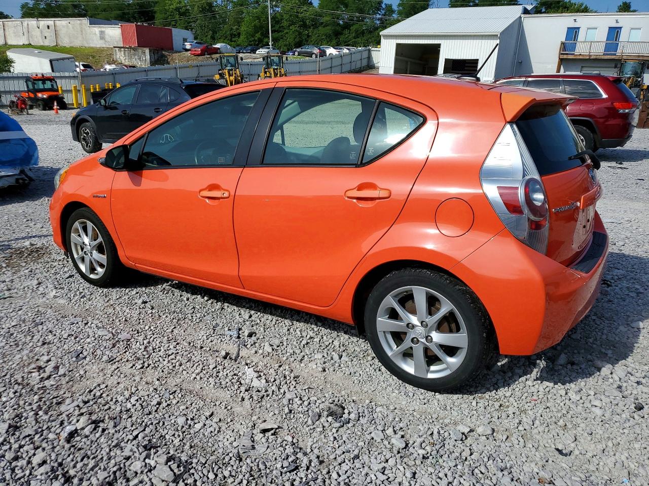 2014 Toyota Prius C Four Оранжевый vin: JTDKDTB39E1083645
