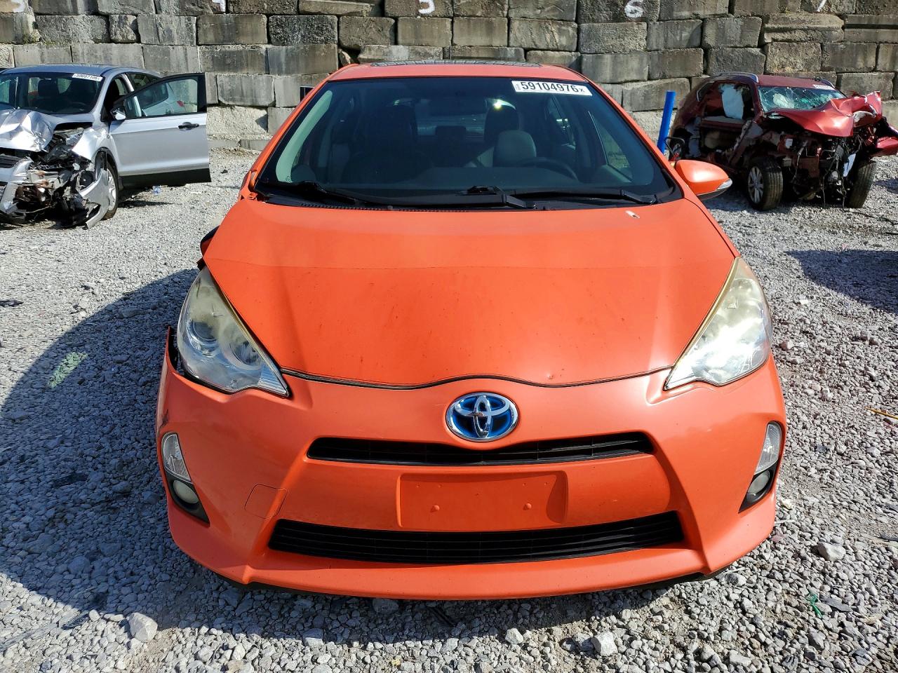 2014 Toyota Prius C Four Оранжевый vin: JTDKDTB39E1083645