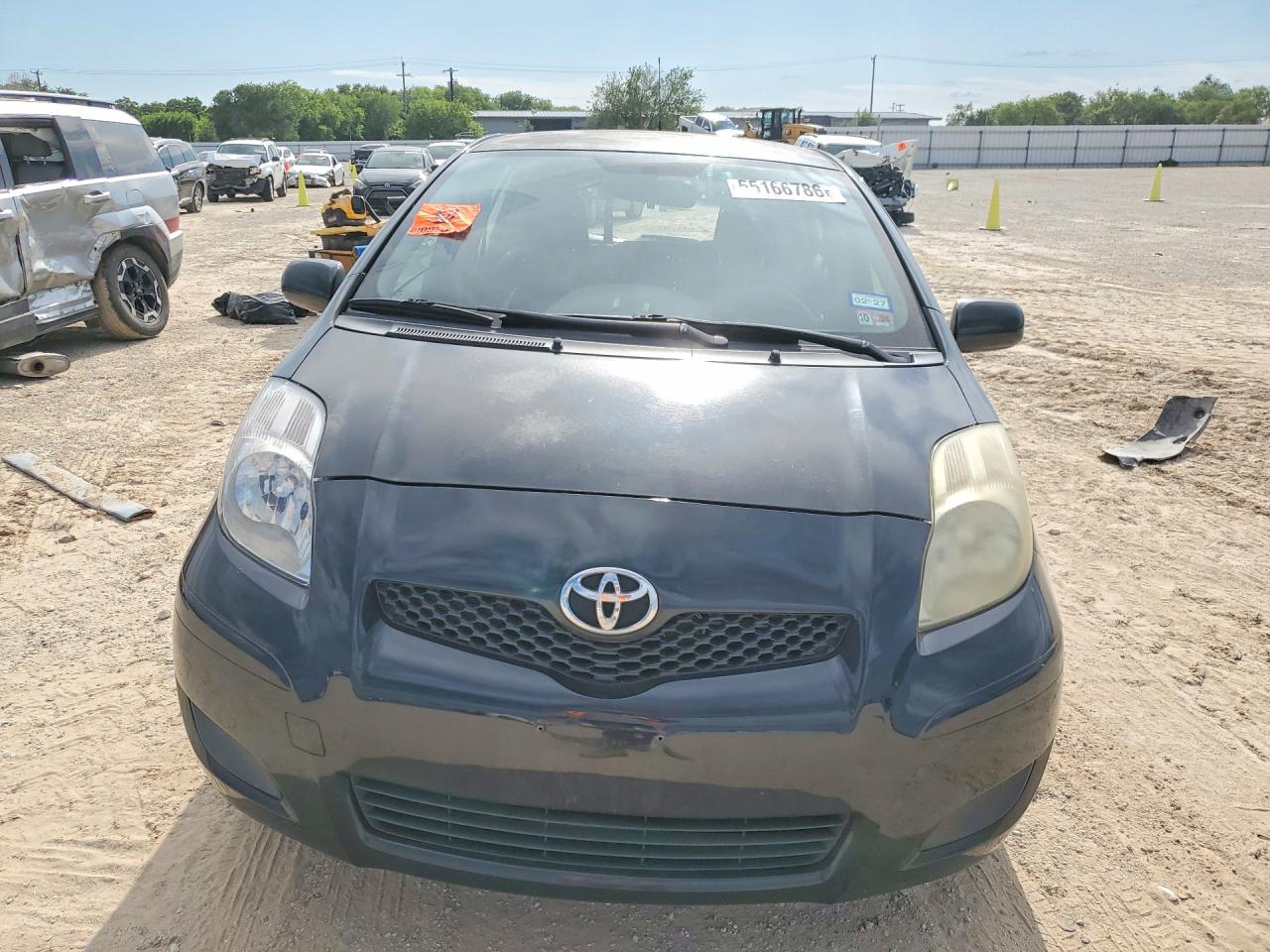 2011 Toyota Yaris Base Black vin: JTDKT4K30B5330516