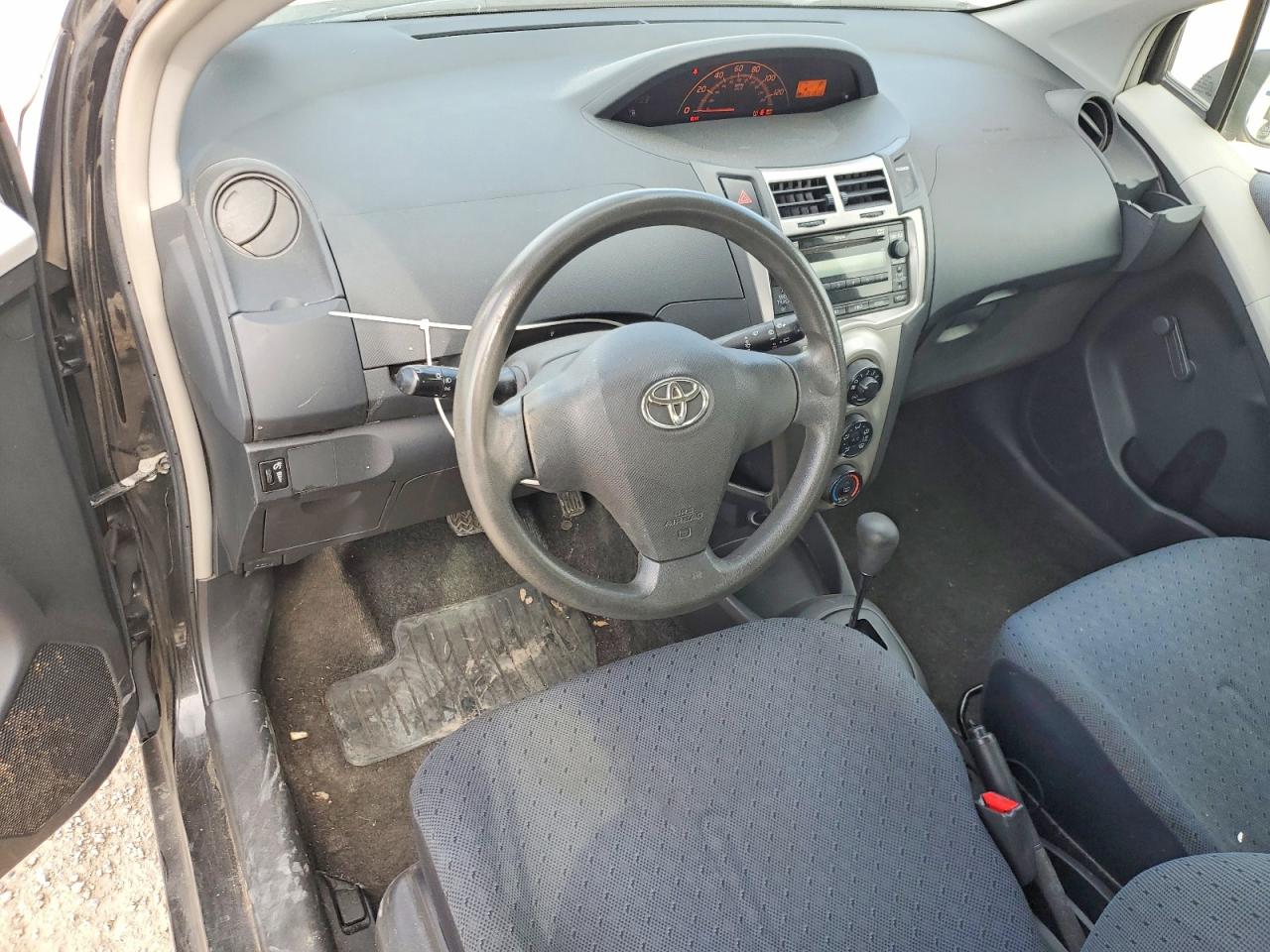 2011 Toyota Yaris Base Black vin: JTDKT4K30B5330516