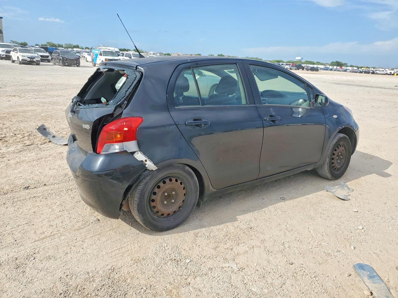 2011 Toyota Yaris Base Black vin: JTDKT4K30B5330516