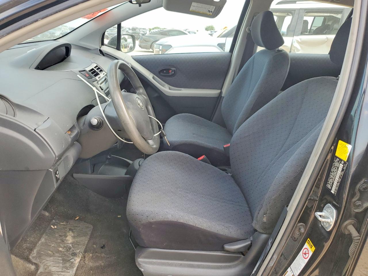 2011 Toyota Yaris Base Black vin: JTDKT4K30B5330516
