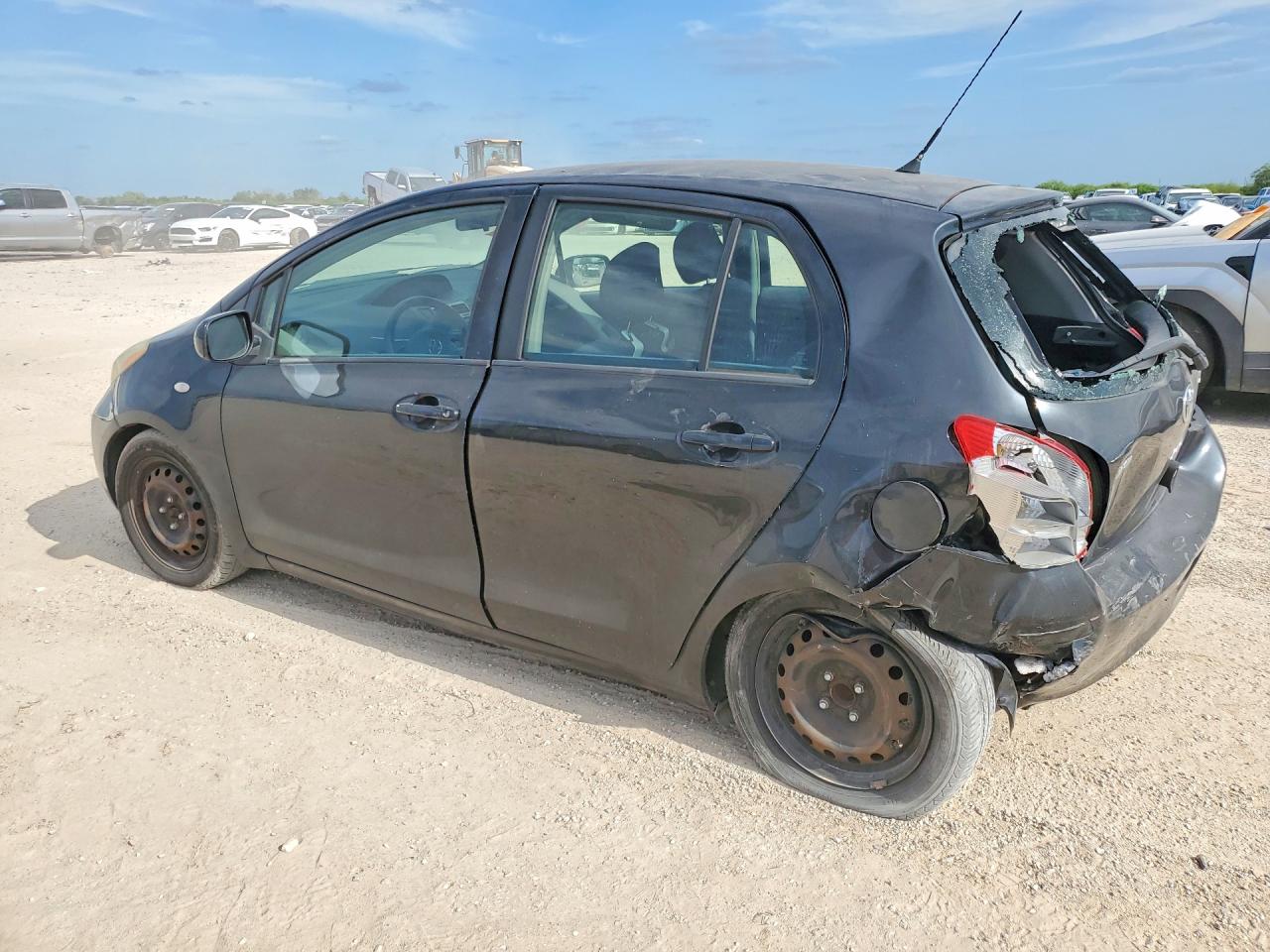 2011 Toyota Yaris Base Black vin: JTDKT4K30B5330516