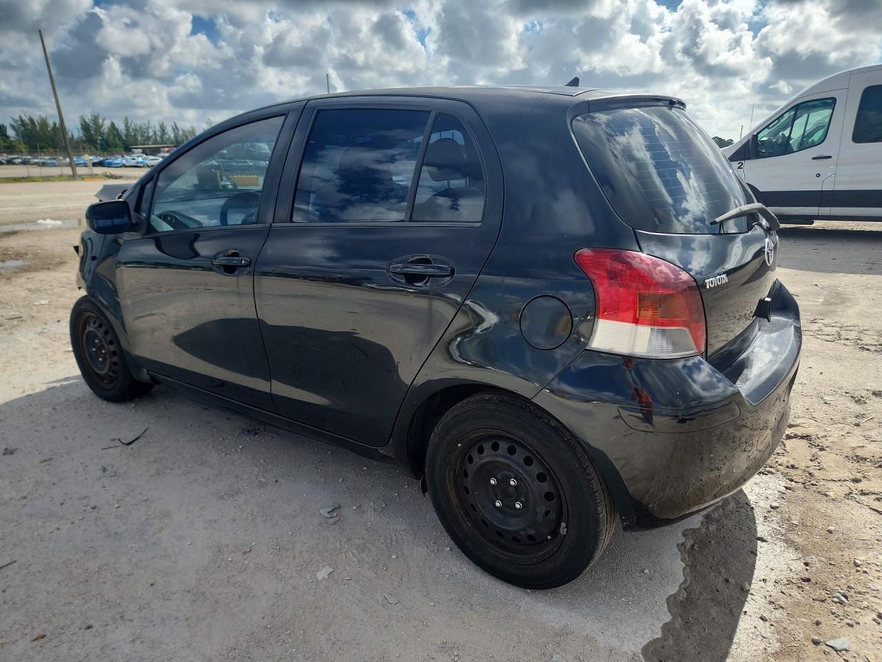 2011 Toyota Yaris Base Black vin: JTDKT4K33B5326721