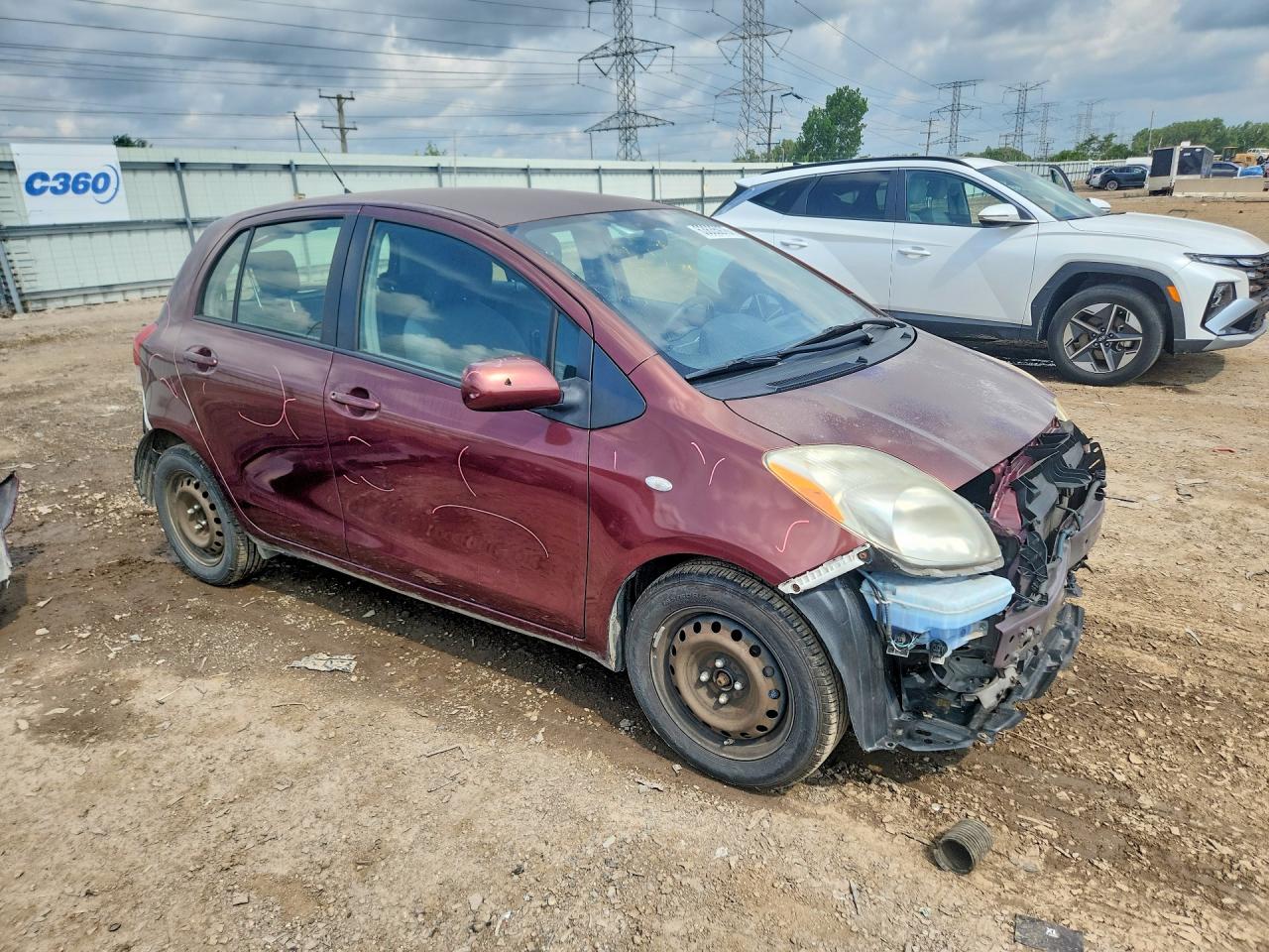 2010 Toyota Yaris Base Burgundy vin: JTDKT4K39A5321702