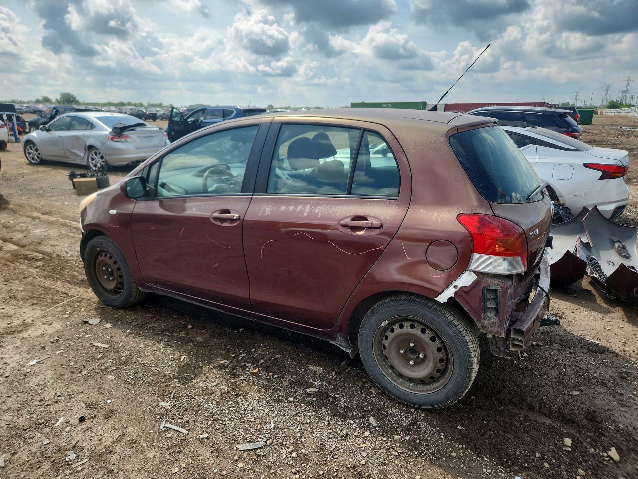2010 Toyota Yaris Base Burgundy vin: JTDKT4K39A5321702