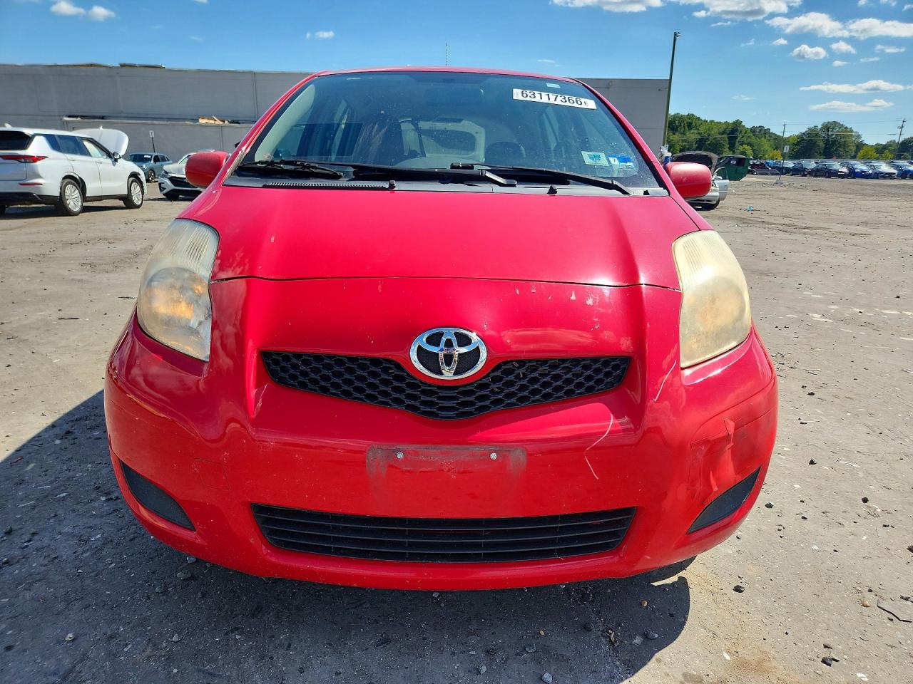 2009 Toyota Yaris Base Red vin: JTDKT903295263024