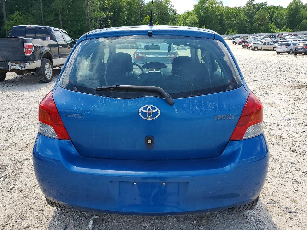 2009 Toyota Yaris Base Blue vin: JTDKT903495255281